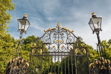 Metal  Gates, fence and street lamp.  London, England