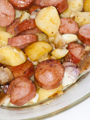 Plate of pieces of sausage, potatoes, garlic and meat