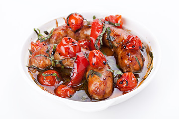 Sausages with stewed vegetables in bow