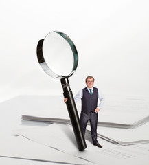 Businessman with big loupe
