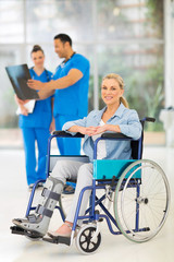 injured woman on wheelchair with doctors