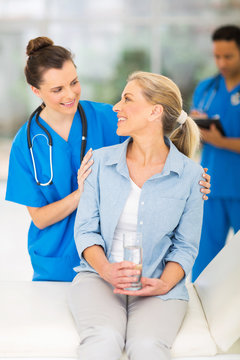 senior patient talking to female nurse