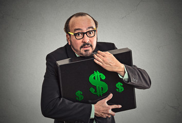 Money greed wealth security concept. Man with briefcase of cash