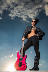girl rocker guitar and sky