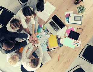 Business team with hands together - teamwork concepts