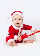 small child dressed as Santa Claus