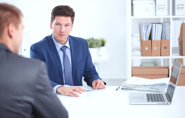 Business people working with laptop in an office