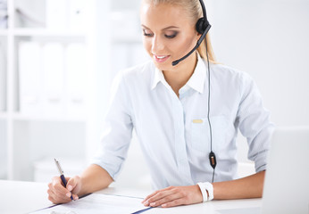Portrait of beautiful businesswoman working at her desk with