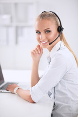 Portrait of beautiful businesswoman working at her desk with