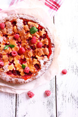 Tasty cake with berries on table close-up