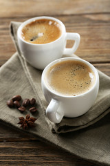 Two cups of coffee on wooden table