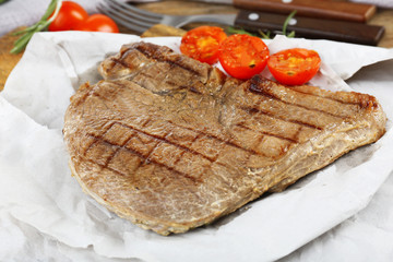 Delicious grilled meat on table