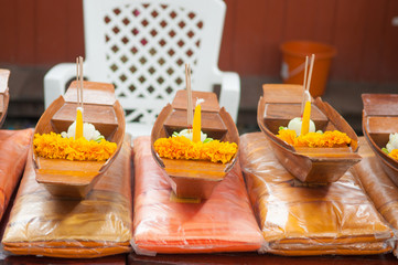 praying oblation in wood boat