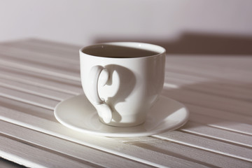 Cup of coffee on wooden table