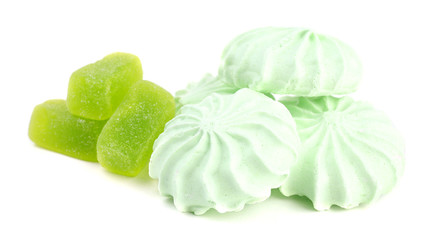 Mint color meringues and mint jelly candies isolated on white