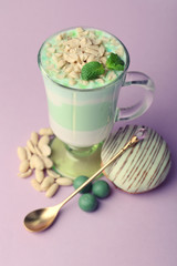 Mint milk dessert in glass, peanuts and mint jelly candies