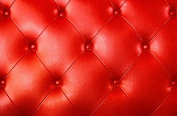 Buttoned on the red Texture leather background