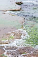 Waves at the shore bedrock