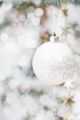 Christmas decorations and snowy blue spruce, bokeh