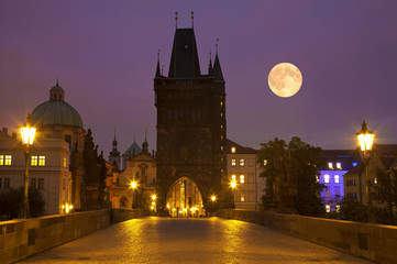 Charles bridge at moonlit night. Prague, Czech Republic