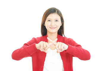 禁止の意思表示をする女性