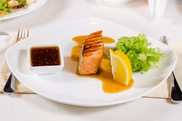 Plated Meal of Grilled Salmon with Sauce