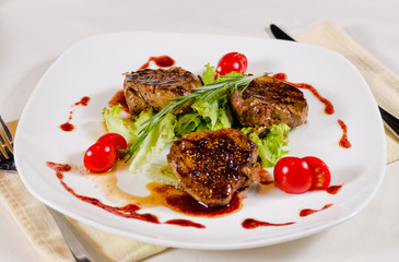 Grilled Meat Cuts with Veggies on White Plate