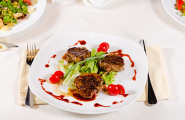 Grilled Meat Cuts with Veggies on White Plate