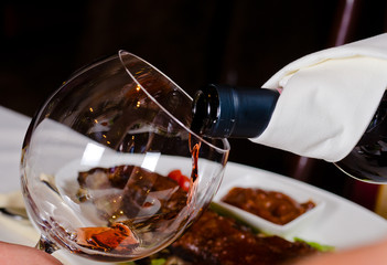 Pouring Red Wine into Glass