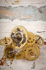 mechanical clock gears on the old wooden table