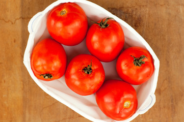 fresh ripe red tomatoes in the box