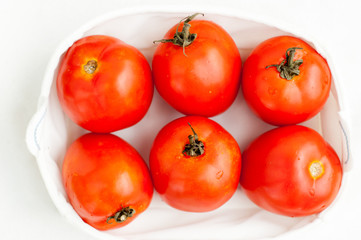 fresh ripe red tomatoes in the box