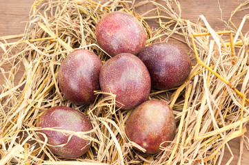 Ripe passion fruits on a wooden background