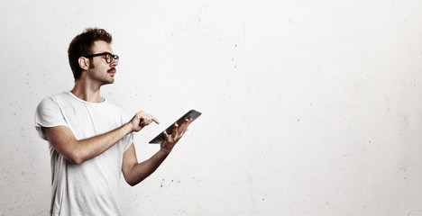 Young man working with digital tablet