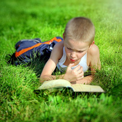 Kid reads a Book