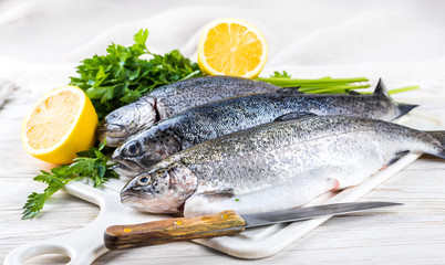 River trout with fresh tomatoes, lemon and herbs - 72867660