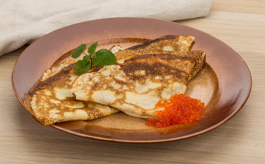 Pancakes with red caviar
