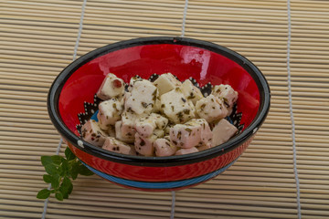 Cheese with spices and oil