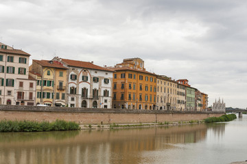 Fototapeta na wymiar Arno River and waterfront buildings, Pisa