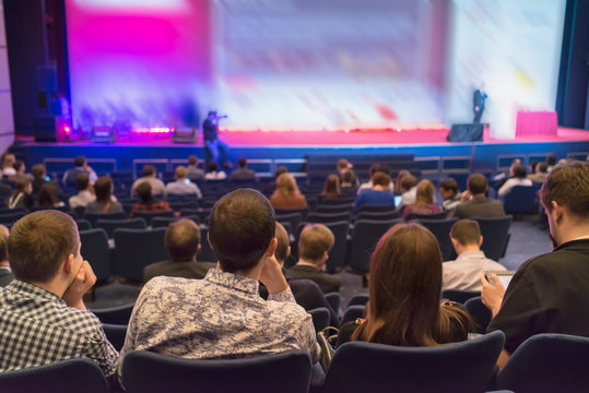 people sitting rear at the business conference