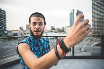 young handsome bearded hipster man selfie