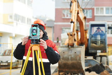 surveyor works with theodolite