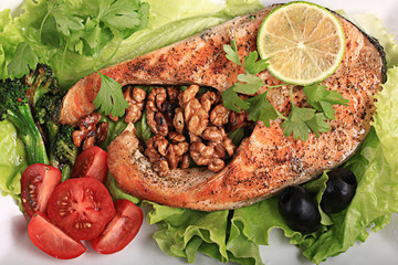 grilled salmon with salad and nuts