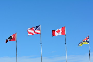 Flags of our nation fly in the breeze.