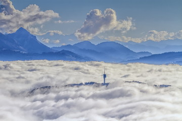 Fototapeta na wymiar Mont-Gibloux and Alps mountains upon clouds, Fribourg,