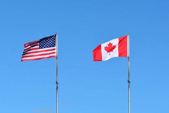 National flags of Canada and the USA.