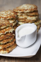 Vegetable fritters of zucchini with parsley and dill closeup  .