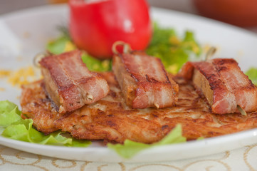 veal meat with bacon