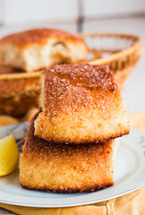 lemon cinnamon rolls on a wooden background