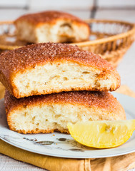 lemon cinnamon rolls on a wooden background